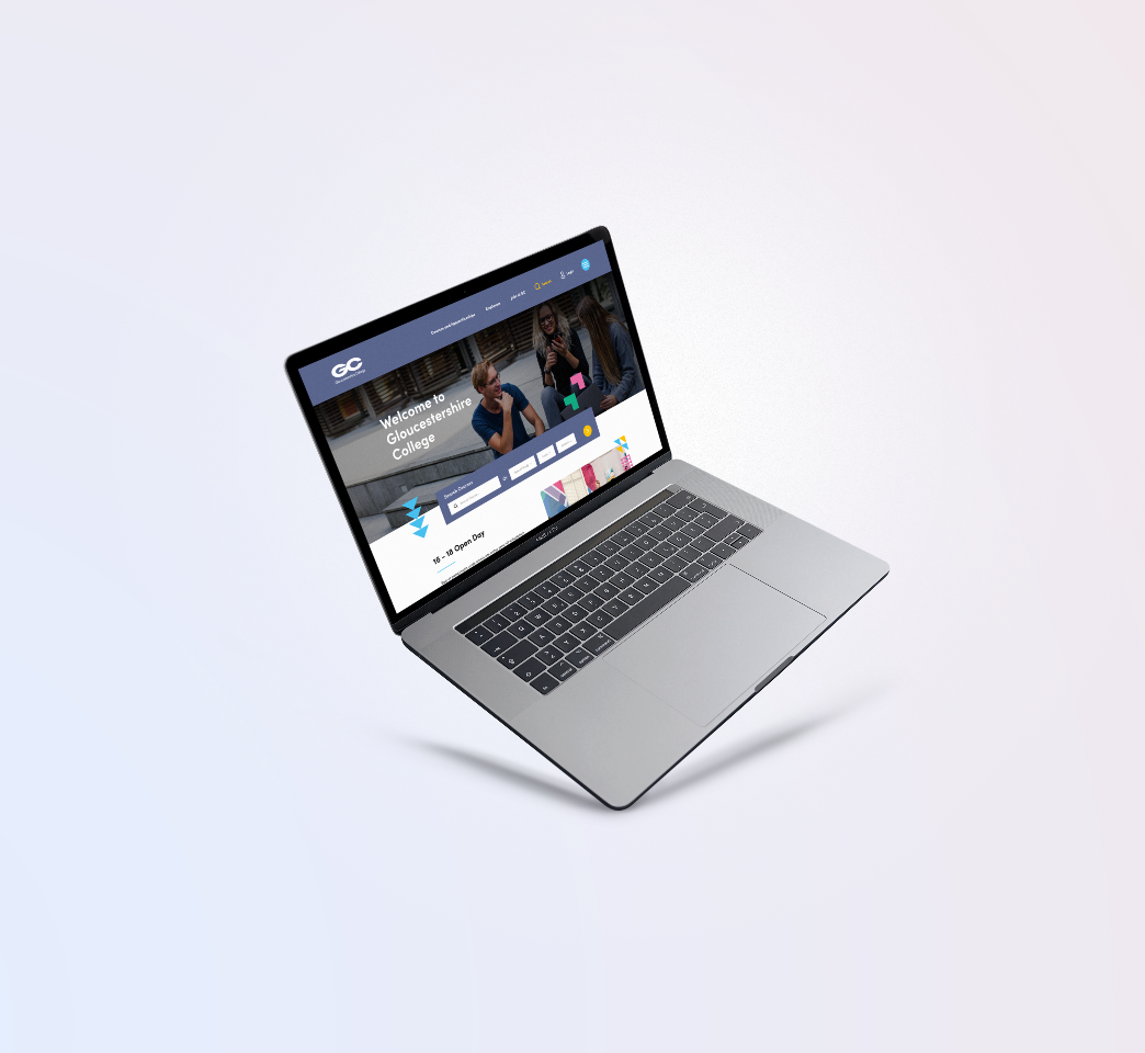 A silver laptop displaying a website homepage with various navigation options and images. The laptop is tilted and floating against a light gradient background.