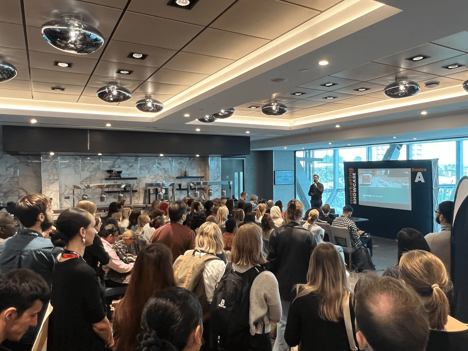 Sean delivering a seminar to a room of people.