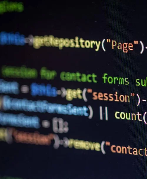 Close-up of a computer screen displaying code in PHP, highlighting functions and variables related to contact forms and session management.